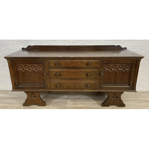 46 - A Gothic style carved oak dressing table - approx. 74cm high x 152cm wide x 45cm deep