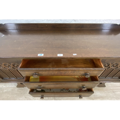 46 - A Gothic style carved oak dressing table - approx. 74cm high x 152cm wide x 45cm deep