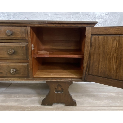 46 - A Gothic style carved oak dressing table - approx. 74cm high x 152cm wide x 45cm deep