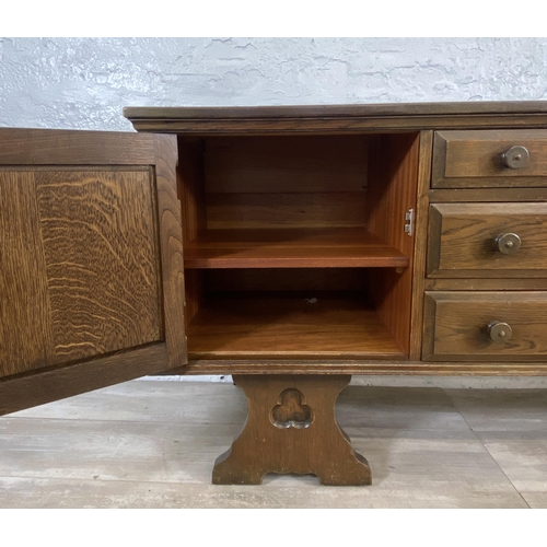 46 - A Gothic style carved oak dressing table - approx. 74cm high x 152cm wide x 45cm deep