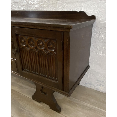 46 - A Gothic style carved oak dressing table - approx. 74cm high x 152cm wide x 45cm deep