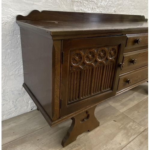 46 - A Gothic style carved oak dressing table - approx. 74cm high x 152cm wide x 45cm deep