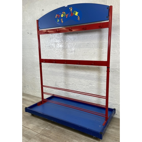 52 - A red metal and blue plastic child's coat rack on castors - approx. 154cm high x 120cm wide x 60cm d... 