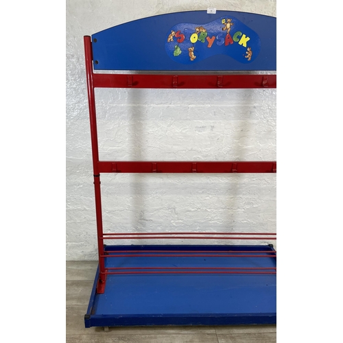 52 - A red metal and blue plastic child's coat rack on castors - approx. 154cm high x 120cm wide x 60cm d... 