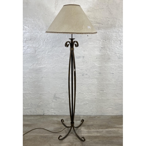 53 - A modern wrought metal standard lamp - approx. 153cm high