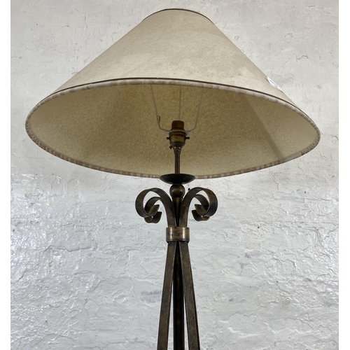 53 - A modern wrought metal standard lamp - approx. 153cm high