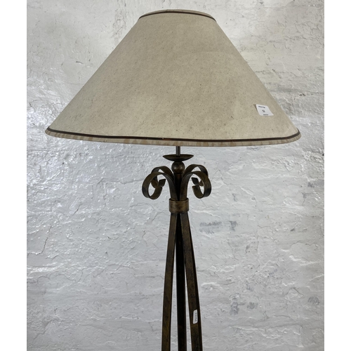 53 - A modern wrought metal standard lamp - approx. 153cm high