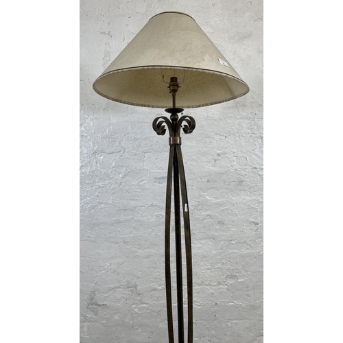 53 - A modern wrought metal standard lamp - approx. 153cm high