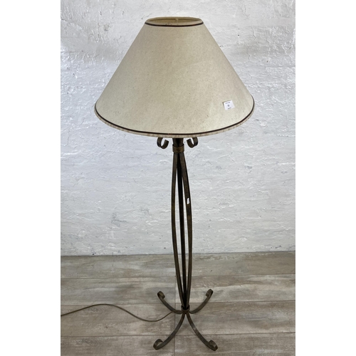 53 - A modern wrought metal standard lamp - approx. 153cm high