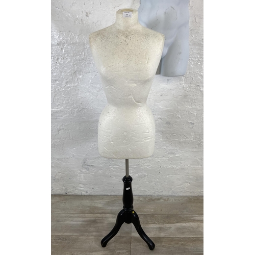 55 - Two mannequins, one plastic hanging male torso and one polystyrene female torso on tripod stand