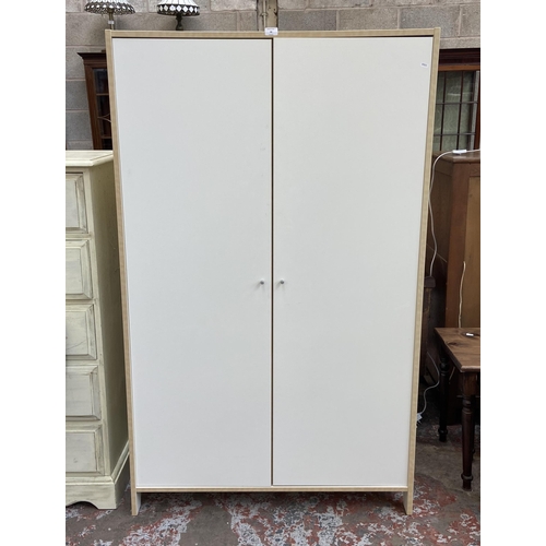 66 - A modern white laminate and beech effect double wardrobe - approx. 166cm high x 100cm wide x 50cm de... 