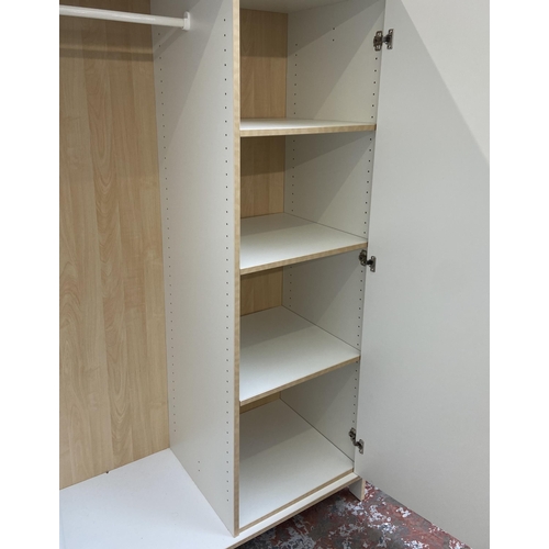 66 - A modern white laminate and beech effect double wardrobe - approx. 166cm high x 100cm wide x 50cm de... 