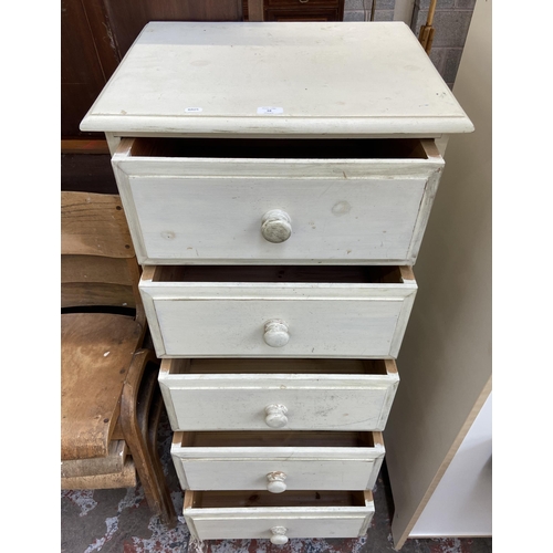 68 - A white painted pine chest of drawers - approx. 127cm high x 57cm wide x 46cm deep