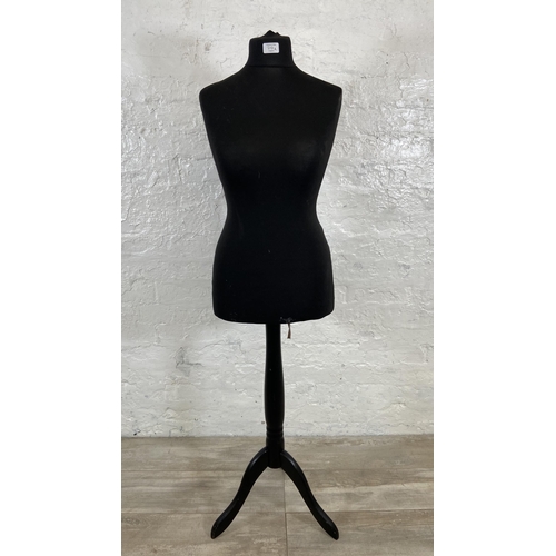 70A - A black fabric female mannequin torso on tripod pedestal stand - approx. 142cm high