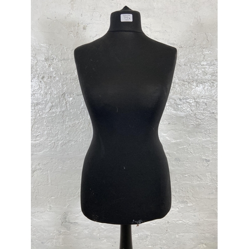 70A - A black fabric female mannequin torso on tripod pedestal stand - approx. 142cm high