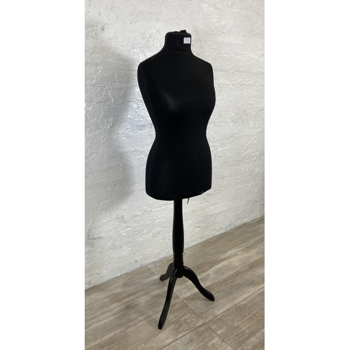 70A - A black fabric female mannequin torso on tripod pedestal stand - approx. 142cm high