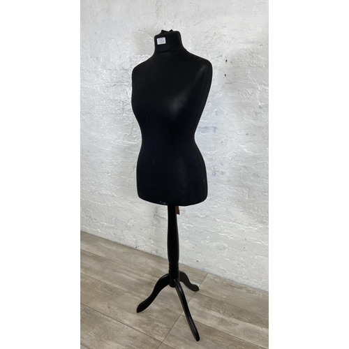 70A - A black fabric female mannequin torso on tripod pedestal stand - approx. 142cm high