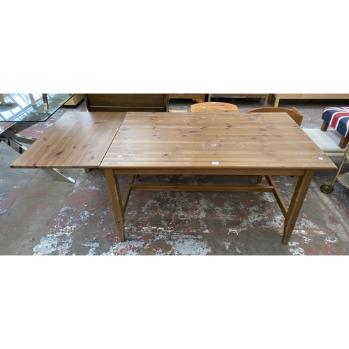 76 - A pine rectangular dining table - approx. 75cm high x 79cm wide x 140cm deep