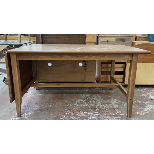 76 - A pine rectangular dining table - approx. 75cm high x 79cm wide x 140cm deep