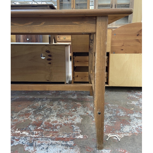 76 - A pine rectangular dining table - approx. 75cm high x 79cm wide x 140cm deep