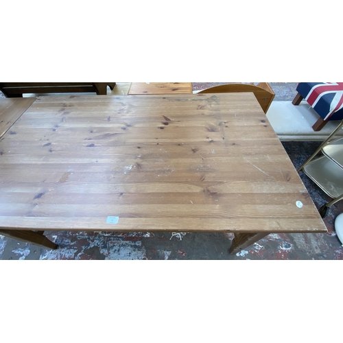 76 - A pine rectangular dining table - approx. 75cm high x 79cm wide x 140cm deep