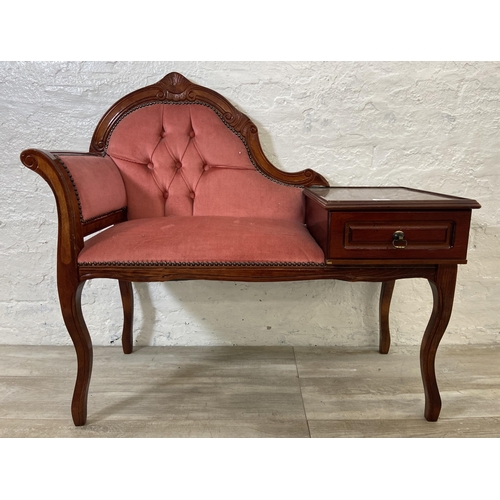 79 - A 19th century style mahogany and pink fabric upholstered telephone table