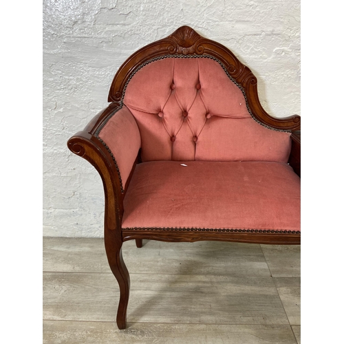 79 - A 19th century style mahogany and pink fabric upholstered telephone table