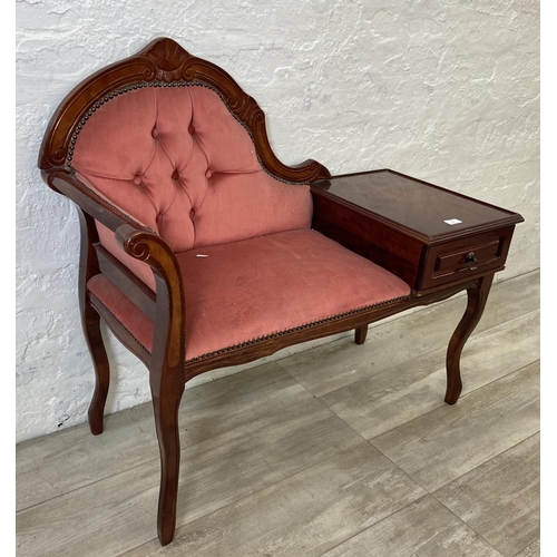 79 - A 19th century style mahogany and pink fabric upholstered telephone table