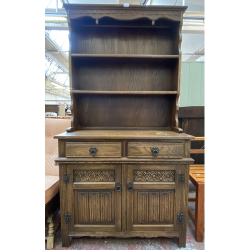 82 - An Old Charm carved oak linenfold dresser - approx. 176cm high x 92cm wide x 44cm deep