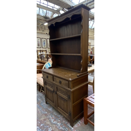 82 - An Old Charm carved oak linenfold dresser - approx. 176cm high x 92cm wide x 44cm deep