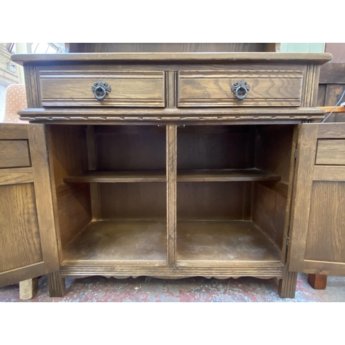 82 - An Old Charm carved oak linenfold dresser - approx. 176cm high x 92cm wide x 44cm deep