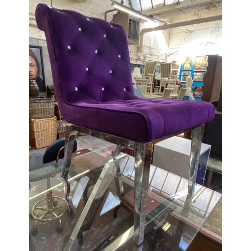 93 - A modern glass top and chrome plated dining table and two purple fabric upholstered and chrome plate... 