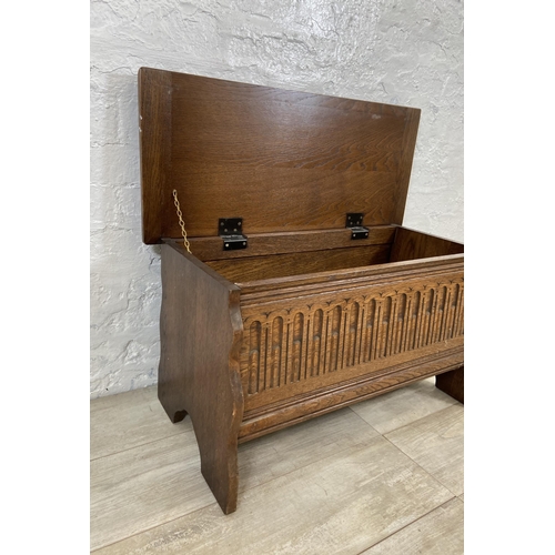 94 - A 17th century style carved oak blanket box - approx. 43cm high x 80cm wide x 34cm deep