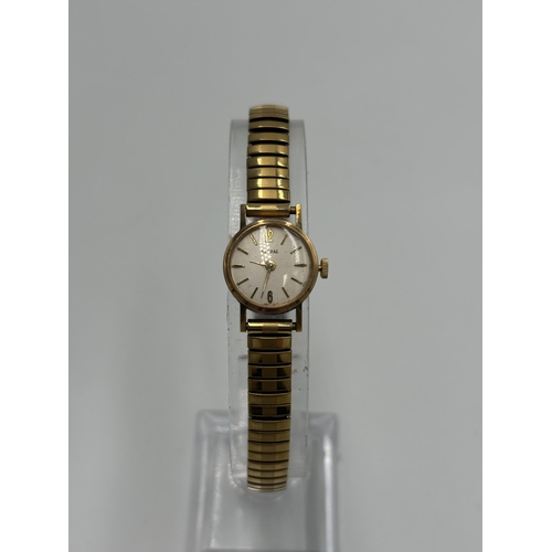 2184 - A vintage Astral 9ct gold cased hand wind lady's wristwatch with stainless steel and gold plated bra... 