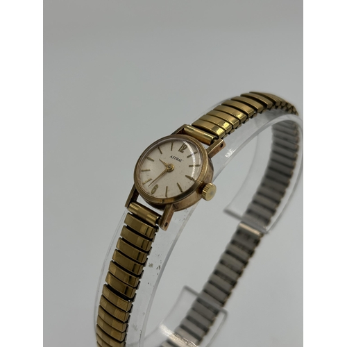 2184 - A vintage Astral 9ct gold cased hand wind lady's wristwatch with stainless steel and gold plated bra... 