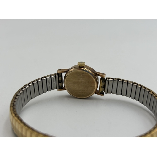 2184 - A vintage Astral 9ct gold cased hand wind lady's wristwatch with stainless steel and gold plated bra... 