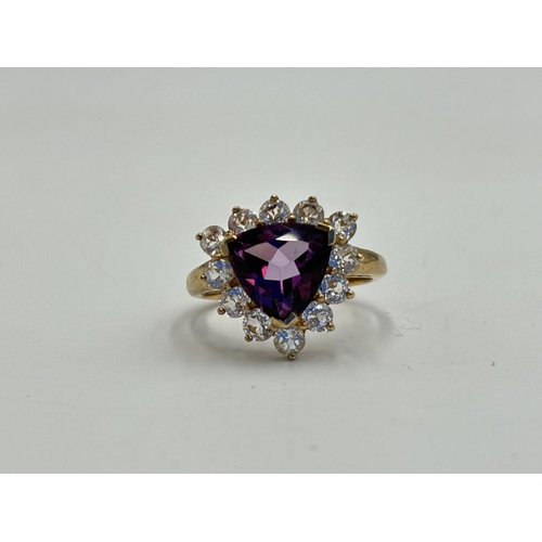 2154C - A hallmarked Birmingham 9ct gold amethyst and clear gemstone cluster ring, size P - approx. gross we... 