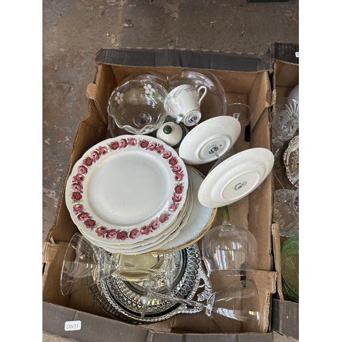 1115 - Two boxes containing glassware, ceramics, Mag 322 set top box etc.