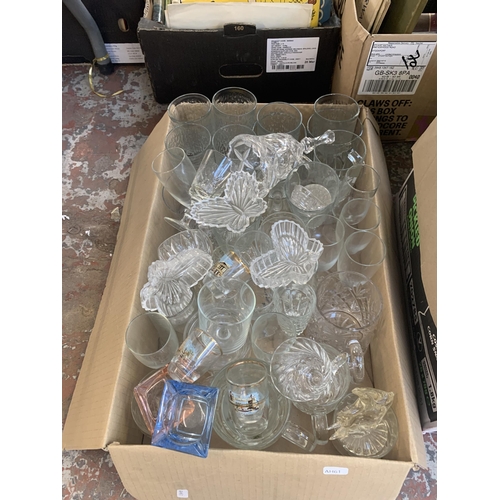 1147 - Two boxes containing glassware and framed butterfly pictures