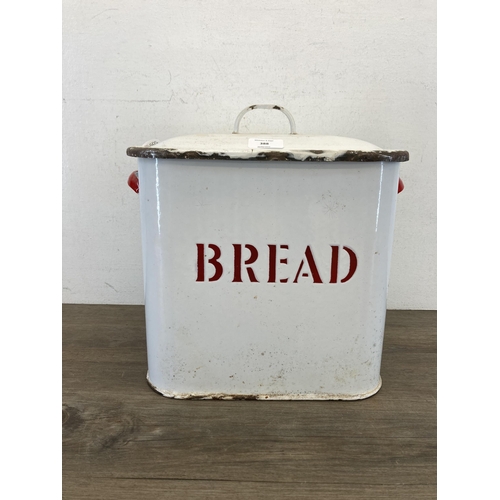 401 - A mid 20th century white and red enamel two handled bread bin - approx. 29cm high x 36cm wide