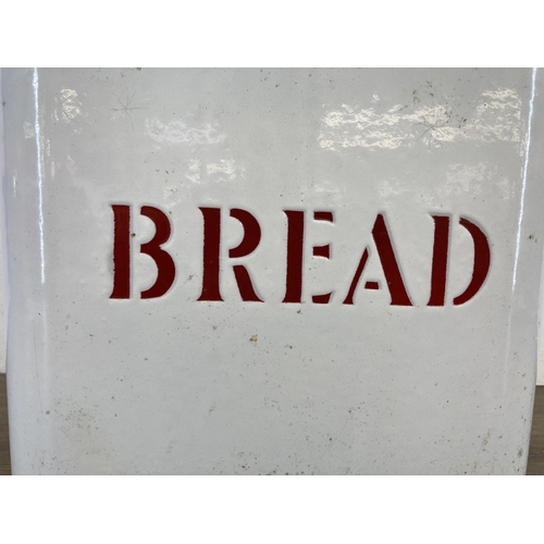 401 - A mid 20th century white and red enamel two handled bread bin - approx. 29cm high x 36cm wide