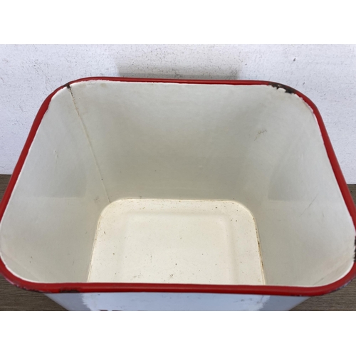 401 - A mid 20th century white and red enamel two handled bread bin - approx. 29cm high x 36cm wide