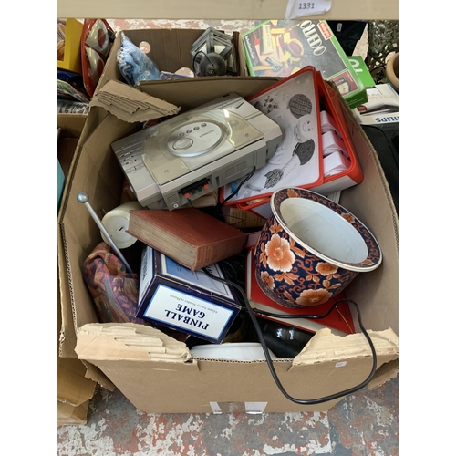 1130 - A large quantity of house clearance items to include books, Halfords cool box, ceramics, glassware e... 