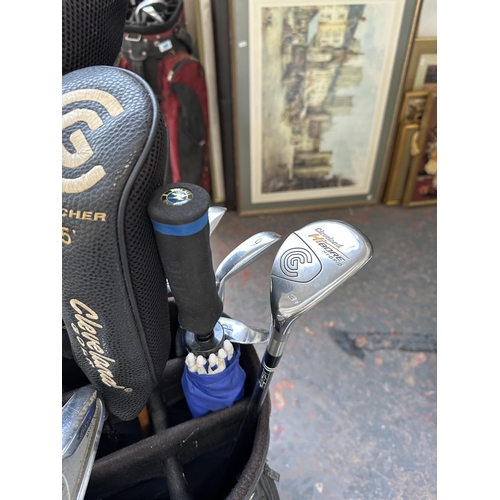 1027 - A Titleist golf bag containing Mizuno MX-23 iron set, two Cleveland launcher woods, Cleveland Hi Bor... 