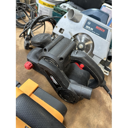 1044 - Three power tools, one Bosch GKS 65 circular saw, one Draper 810w belt sander and one JCB planer