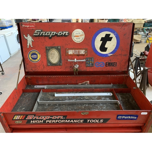 1067 - A Snap-On red metal rolling tool chest with contents and keys - approx. 135cm high x 67cm wide x 46c... 