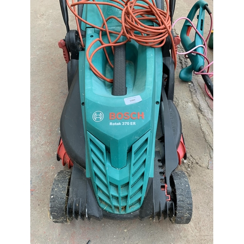 1089 - Three electric garden tools, one Bosch Rotak 370ER lawn mower, one Bosch ART26SL strimmer and one ot... 