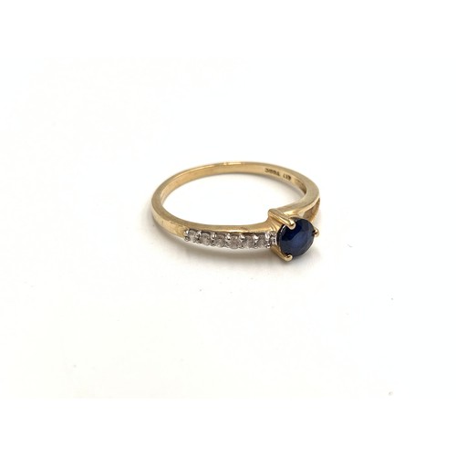 2151 - A TGGC hallmarked 9ct gold sapphire and CZ ring, size O - approx. gross weight 1.45g