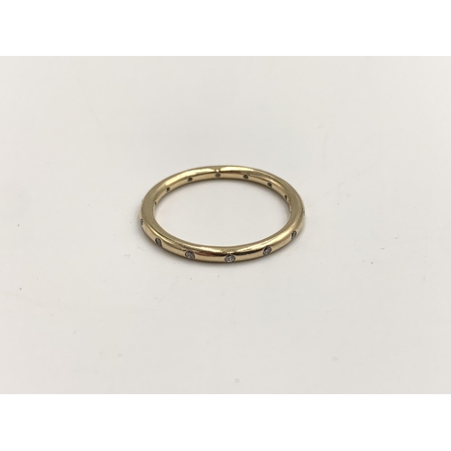 2120 - A Pandora 14ct gold CZ eternity ring, size R - approx. gross weight 2.32g