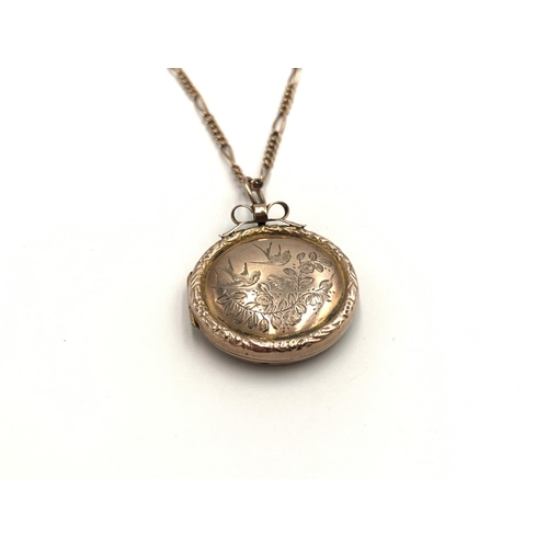 2139 - A 9ct gold chain necklace with yellow metal foliate and bird etched locket - approx. gross weight 10... 